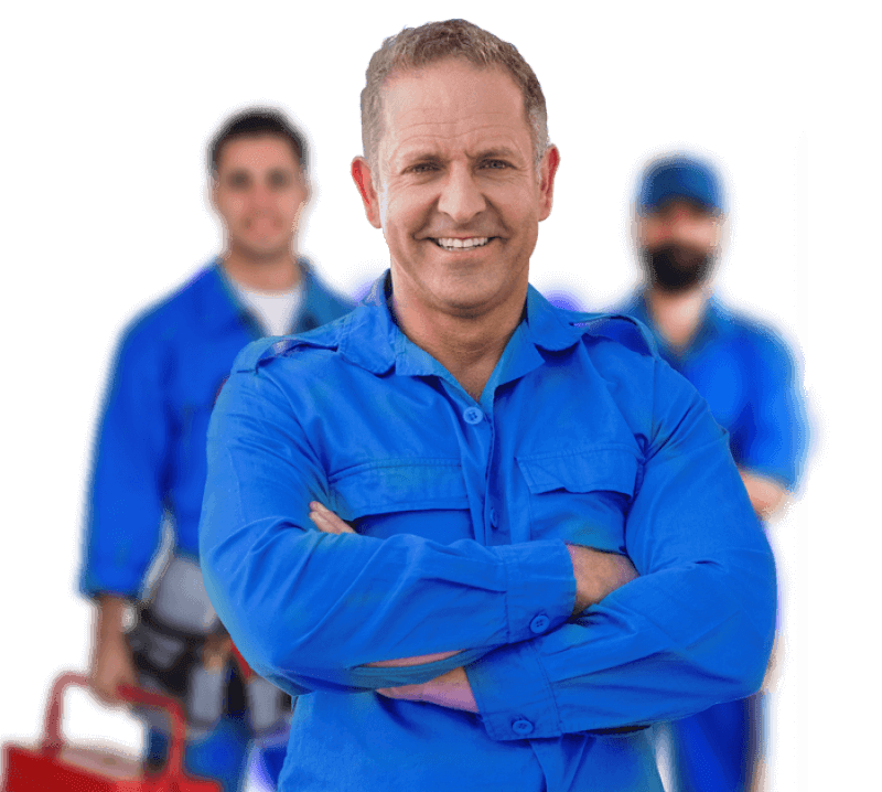 A group of three men in blue work uniforms, standing confidently with tools, against a black background.
